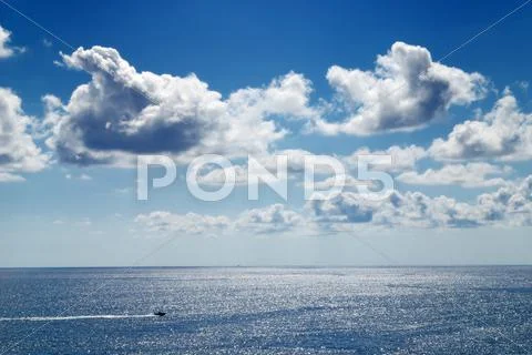 Cloudy sky and sea Stock Photos