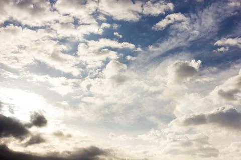 Cloudy sky and sun Stock Photos