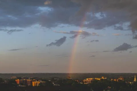 Cloudy sky and sunset in summer day, rainbow in Hackensack New Jersey. Area view Stock Photos