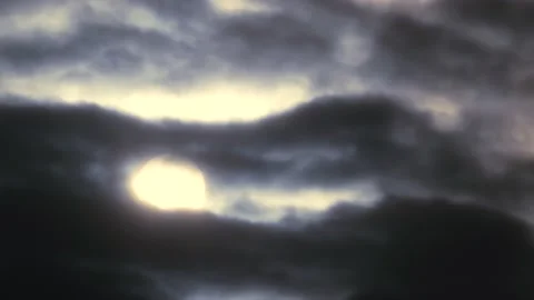 Cloudy sky and white sun behind clouds at sunrise - sky background - Time Lapse Stock Footage 150009547