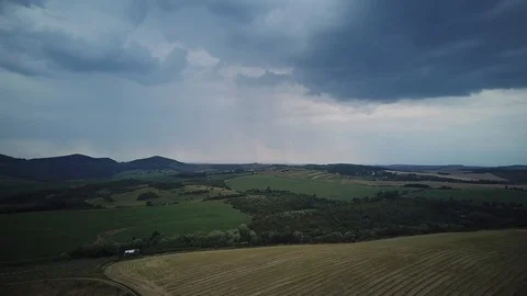 Cloudy sky, approaching rain. Countryside view from above. Stock Footage 114651610