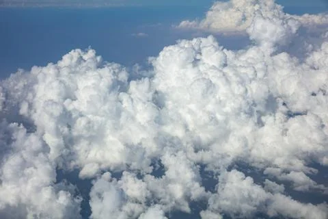 Cloudy sky background. View out of a plane window. Stock Photos