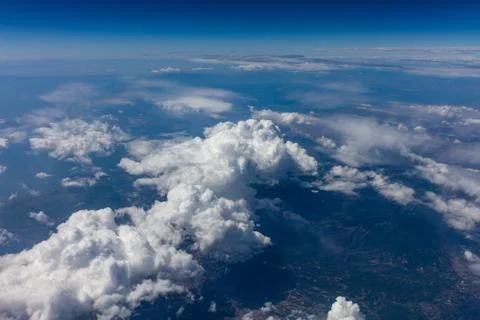 Cloudy sky background. View out of an airplane window. Stock Photos