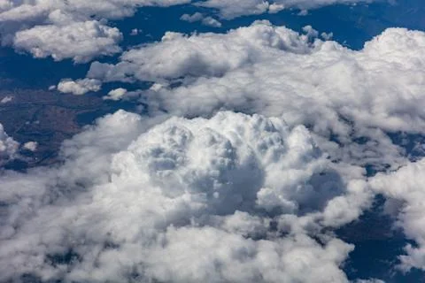 Cloudy sky background. View out of an airplane window. Stock Photos