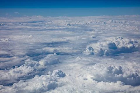 Cloudy sky background. View out of an airplane window. 写真素材