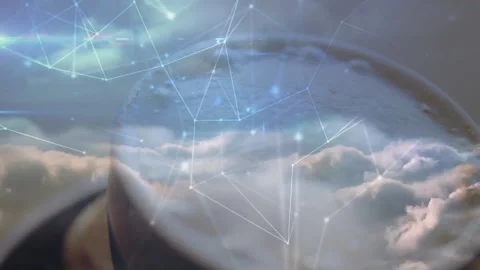 Cloudy sky being magnified through circular glass lens, showing network nodes Stock Footage 307445182