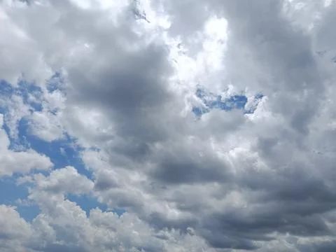 Cloudy Sky with Blue Openings Stock Photos