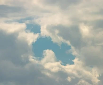 A cloudy sky with a blue sky in the background Stock Photos