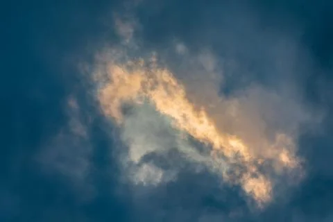 Cloudy Sky Breaks Through with Sunset Light 写真素材