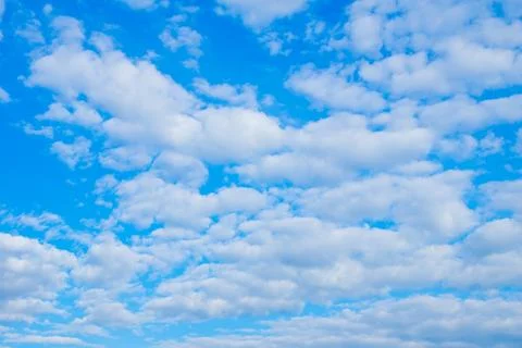 Cloudy sky with bright blue background during daytime in open air Stock Photos