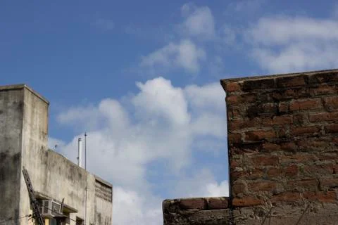 Cloudy sky with building tops Stock Photos
