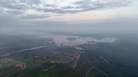 Cloudy sky casts soft light on expansive river landscape Stock Footage 333056944