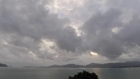Cloudy sky clouds over the ocean bay beautiful sunset timelapse Stock Footage 265937337