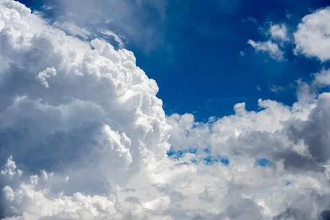 A cloudy sky with deep blues and bright whites Stock Photos