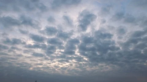 Cloudy sky down to skyline across the river, grass in foreground at end Baton Stock Footage 53369220