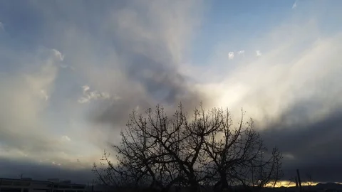 Cloudy sky - Drone camera moves down and back Stock Footage 128796934