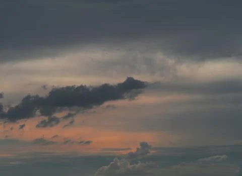 Cloudy sky During the setting sun Splash the orange light out. Sunset concept Stock Photos