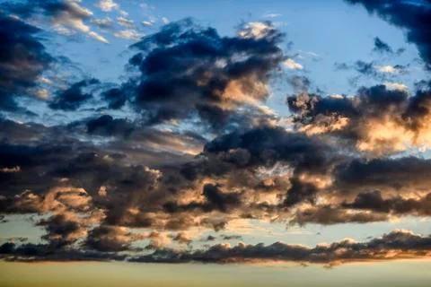 Cloudy sky during sunset in blue and pink Stock Photos
