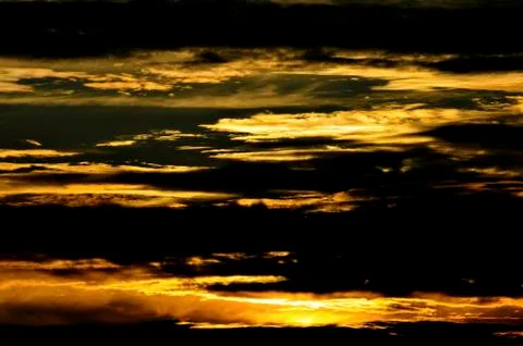Cloudy sky during a sunset Stock Photos