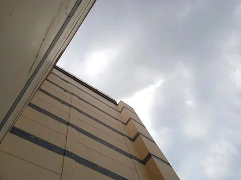 A cloudy sky enveloped the building Stock Photos