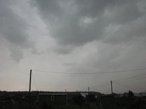 Cloudy sky in the evening. View from the side of the road. Stock Photos