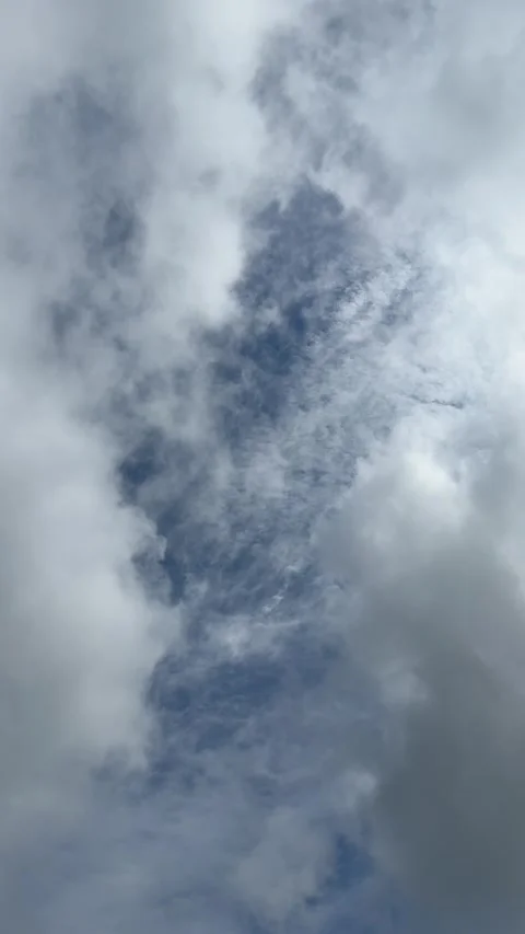 Cloudy sky. Fluffy clouds floating in the sky, vertical video. Stock Footage 338349411