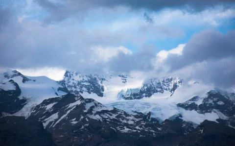 Cloudy Sky in front of Mount Rosa Фото