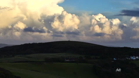 A cloudy sky with a hill in the background Stock Footage 298287427