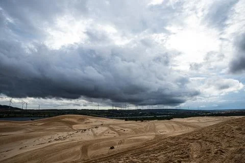 A cloudy sky with a hill in the background Stock Photos