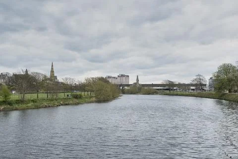 Cloudy sky hovers over calm water Stock Photos