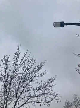 Cloudy sky, lamppost Foto stock