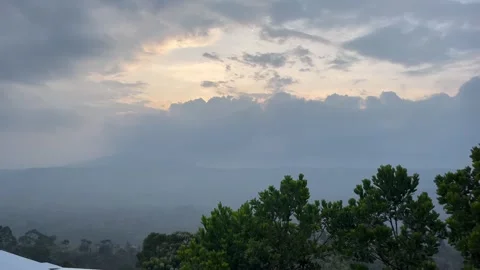 Cloudy Sky Landscape with Distant Mountains and Natural Greenery Stock Footage 310823715