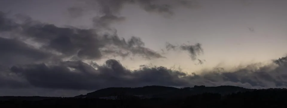 Cloudy sky landscape - storm clouds in the wind over the horizon Stock Photos