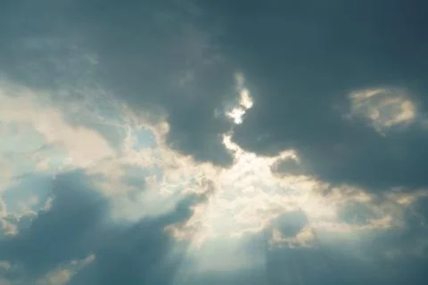 Cloudy sky landscape with sun rays Stock Photos