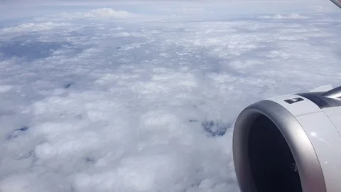 Cloudy Sky look from airplane window Stock Footage 116955190