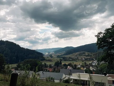 Cloudy sky with a mountain in the background Stock Photos