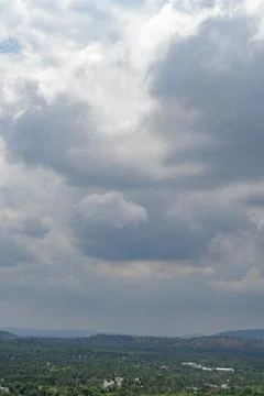 A cloudy sky with a mountain in the background 写真素材