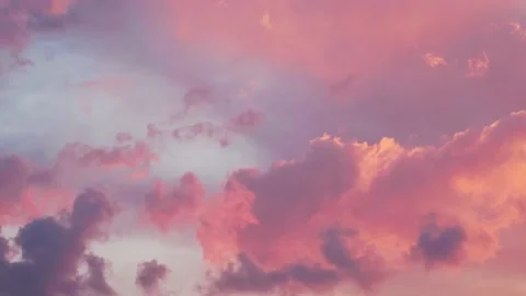 Cloudy sky. Moving evening gold orange pink clouds on blue sky Timelapse Video stock 208964886