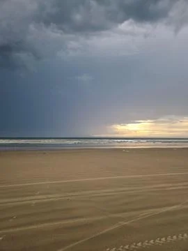 Cloudy Sky over the Beach Stock Photos