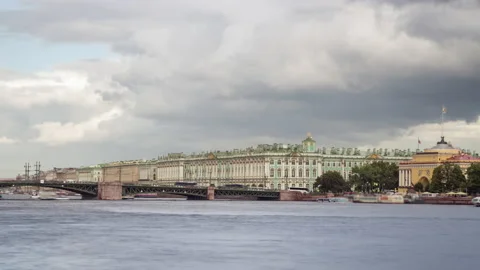 Cloudy sky over the Bridge and Winter Palace with boats on the Neva River. Stock Footage 182446680