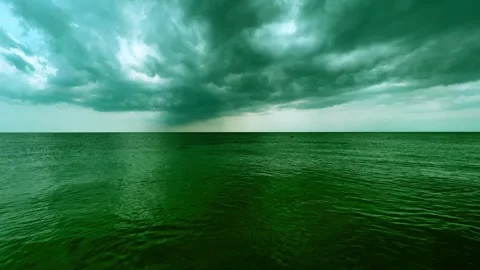Cloudy sky over calm sea with bathing people, green Stock Footage 277516587