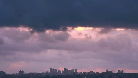 Cloudy sky over city at sunset, timelapse Stock Footage 83635936