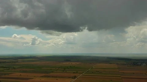 Cloudy sky over the fields in summer - Dobrogea, Romania Stock Footage 137713332