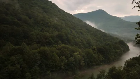 Cloudy sky over the fogy river timelapse Stock Footage 137886735