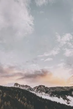 Cloudy sky over the forest at the S.Ciascian Mountains, Badia, Italy Stock Photos