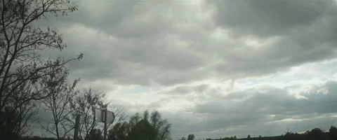 Cloudy sky over green valley cinemascope Stock Footage 242861997