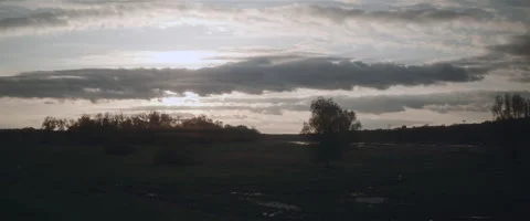 Cloudy sky over green valley in the evening Stock Footage 242862871
