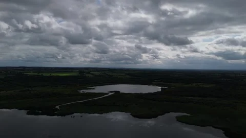 A cloudy sky over a lake and a river Stock Footage 328523033