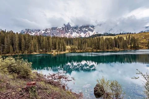 Cloudy sky over Lake Carezza in South Tyrol, Italy. Stock Photos