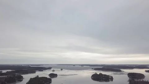 Cloudy sky over lake with partly frozen ice cover. Stock Footage 127807958